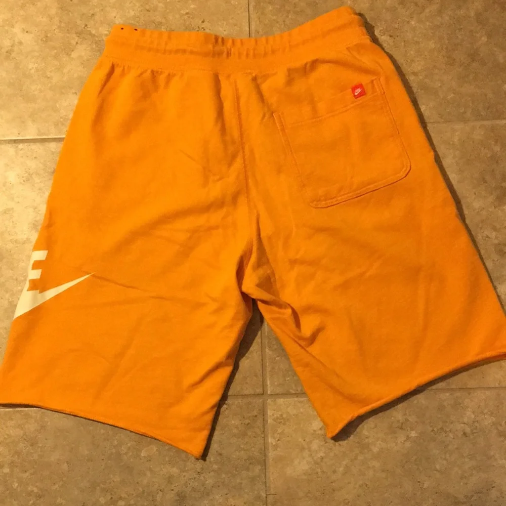 Nike Orange Men's Athletic Shorts with White Logo